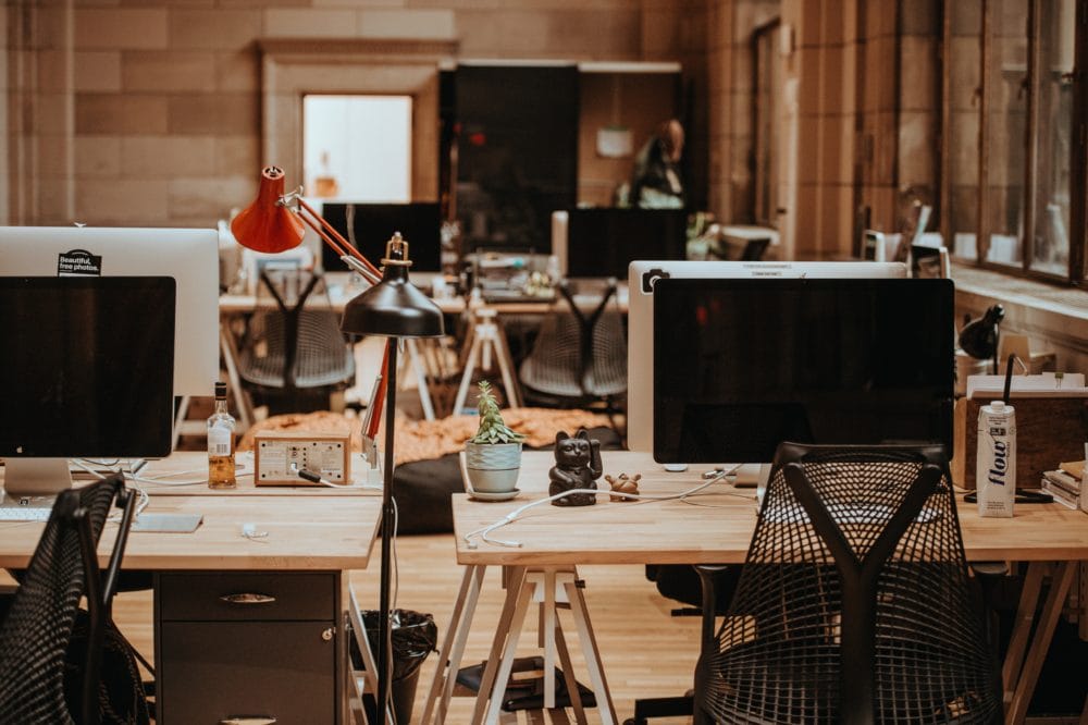 annie-spratt-439326-unsplash-e1539851269873 Desk with wooden table and computer