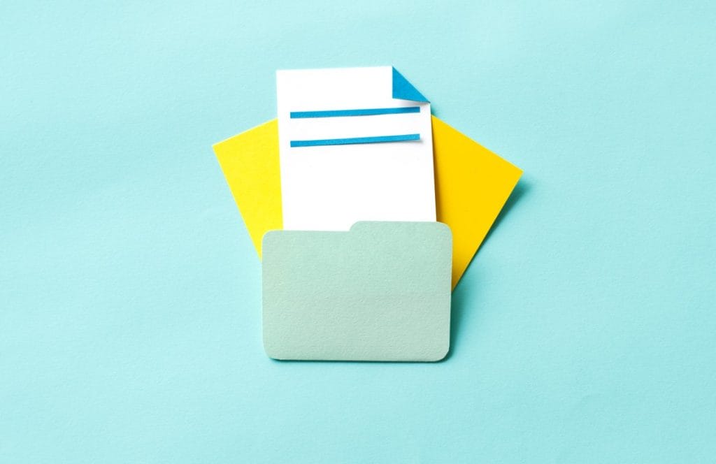 folder Folder with white and yellow sheets coming out of it in a teal background