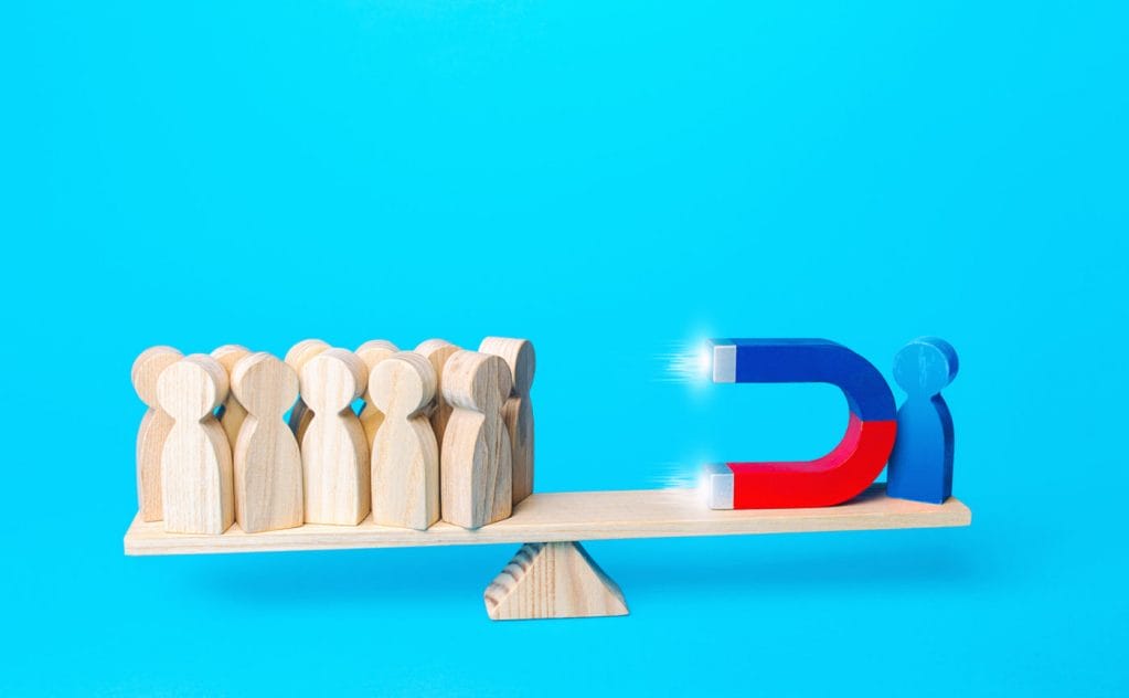 A person attracts people to his side with a magnet. Influence, manipulate the opinion of electorate. Collecting support. Endear. Gather followers around an idea. Political weight, opinion leader.